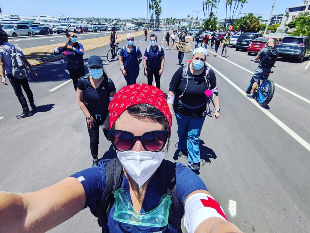 Danisha Jenkins taking a selfie with goggles while marching