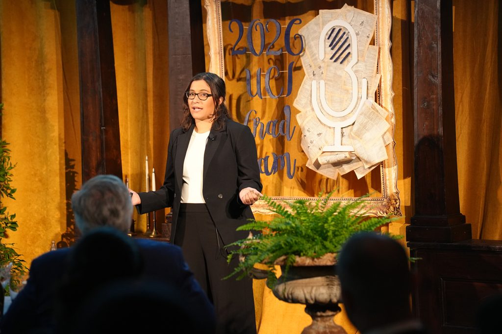 Savannah Plaskon presenting on stage