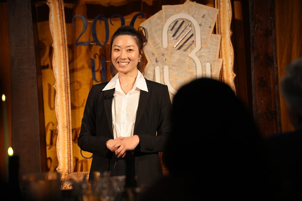 Celina Yang presenting on stage