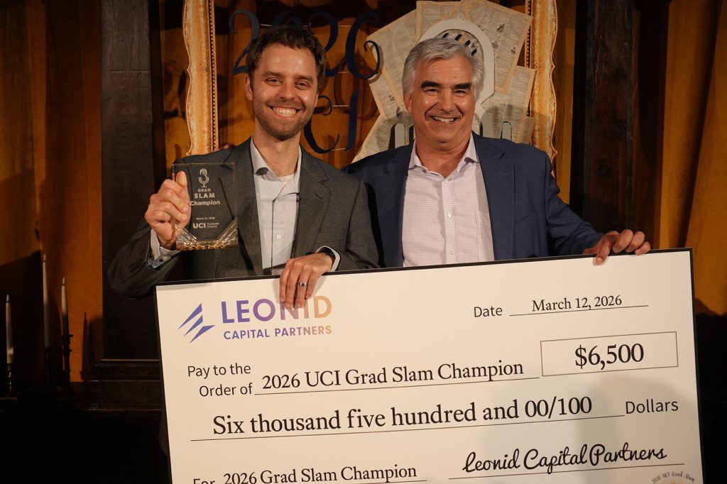 Cameron Geller and Ted Lanes posing with overside check from Leonid for $6,500