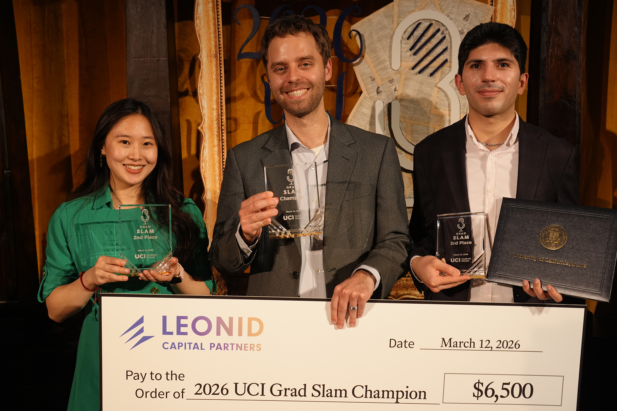 Tessa Chou, Cameron Geller and Mehdi Zafari all holding their trophies